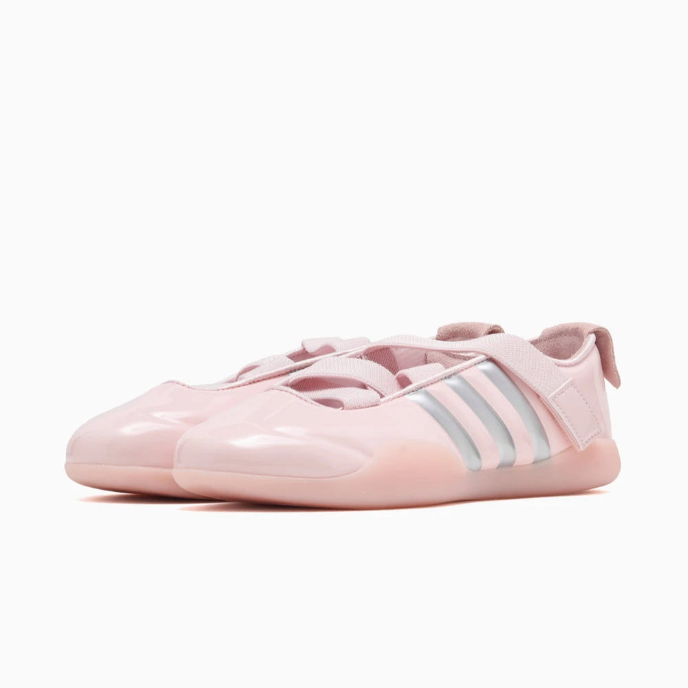 Adidas Clot Taekwondo Pink sneakers with silver stripes. 