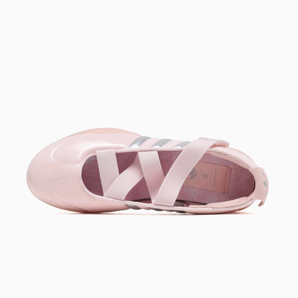 Pink adidas taekwondo ballet shoe with striped design on a white background