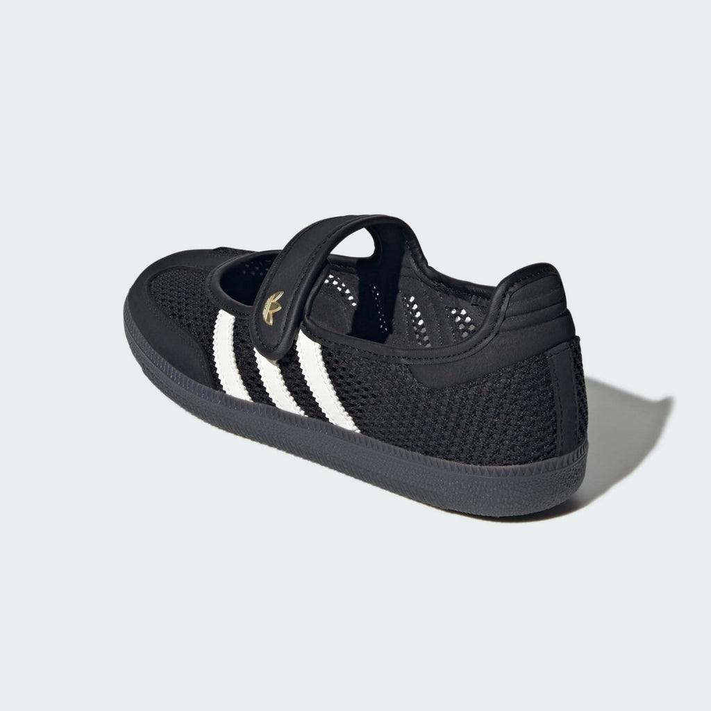 A black mesh low-top sneaker with three white stripes and a gold adidas logo on the side, shown from a three-quarters rear angle on a light gray background.