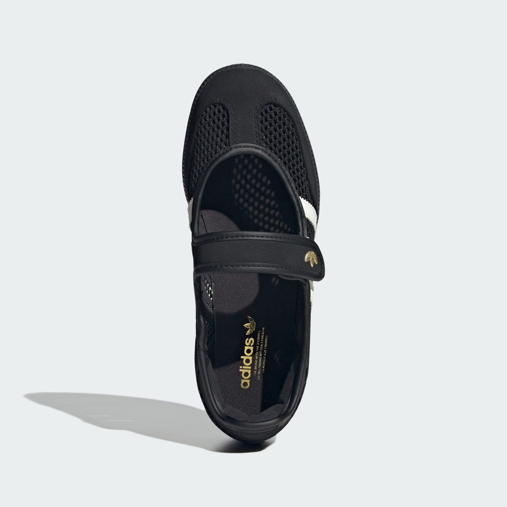 Black Adidas sandal with a strap on a white background