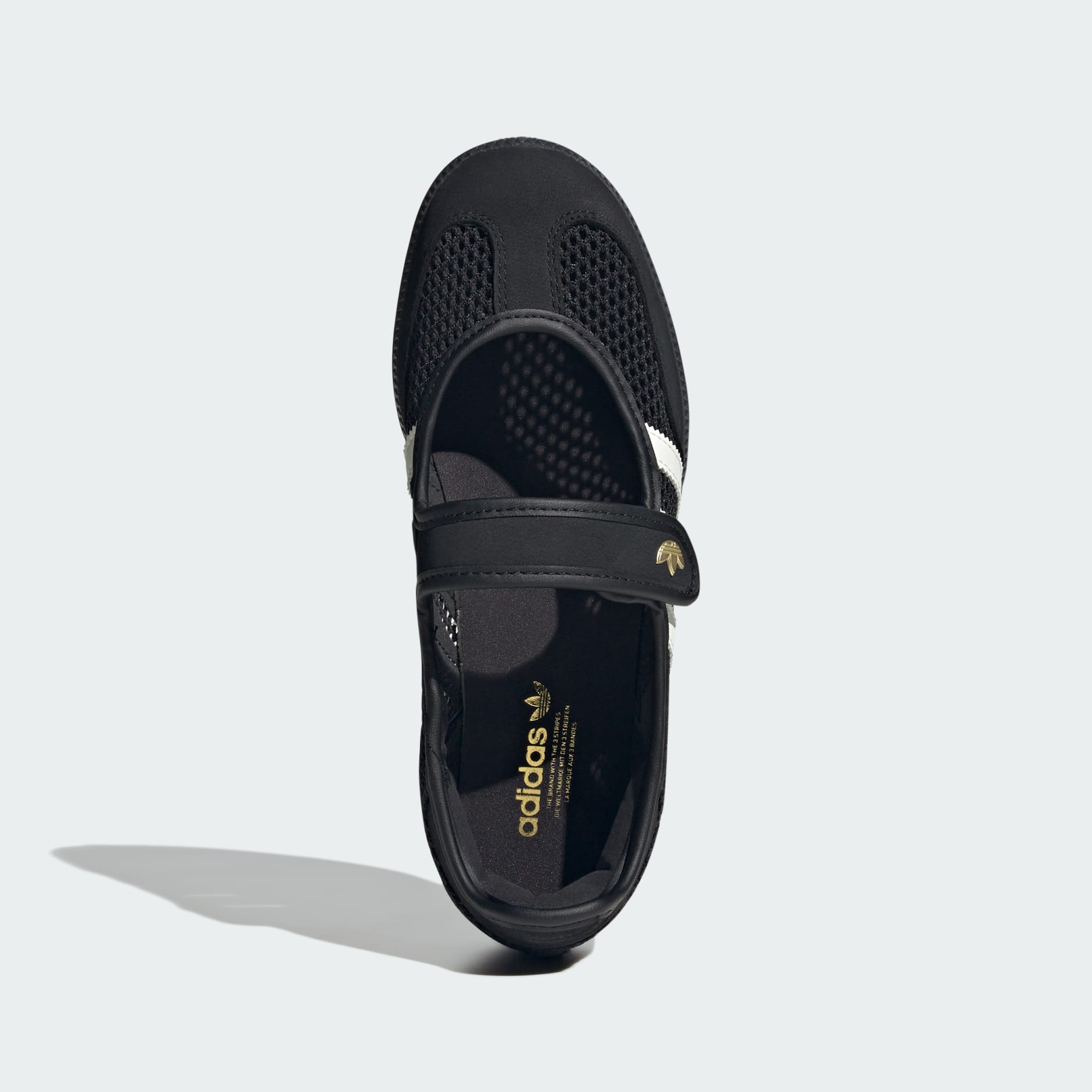 Black Adidas sandal with a strap on a white background