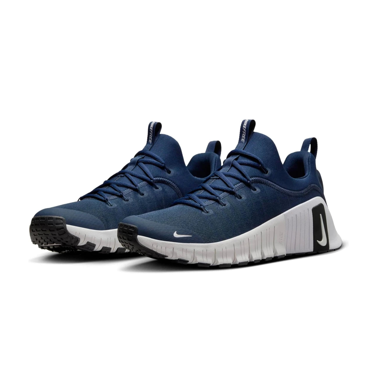 Pair of Navy blue Nike metcon 6 running shoes with white soles on a white background