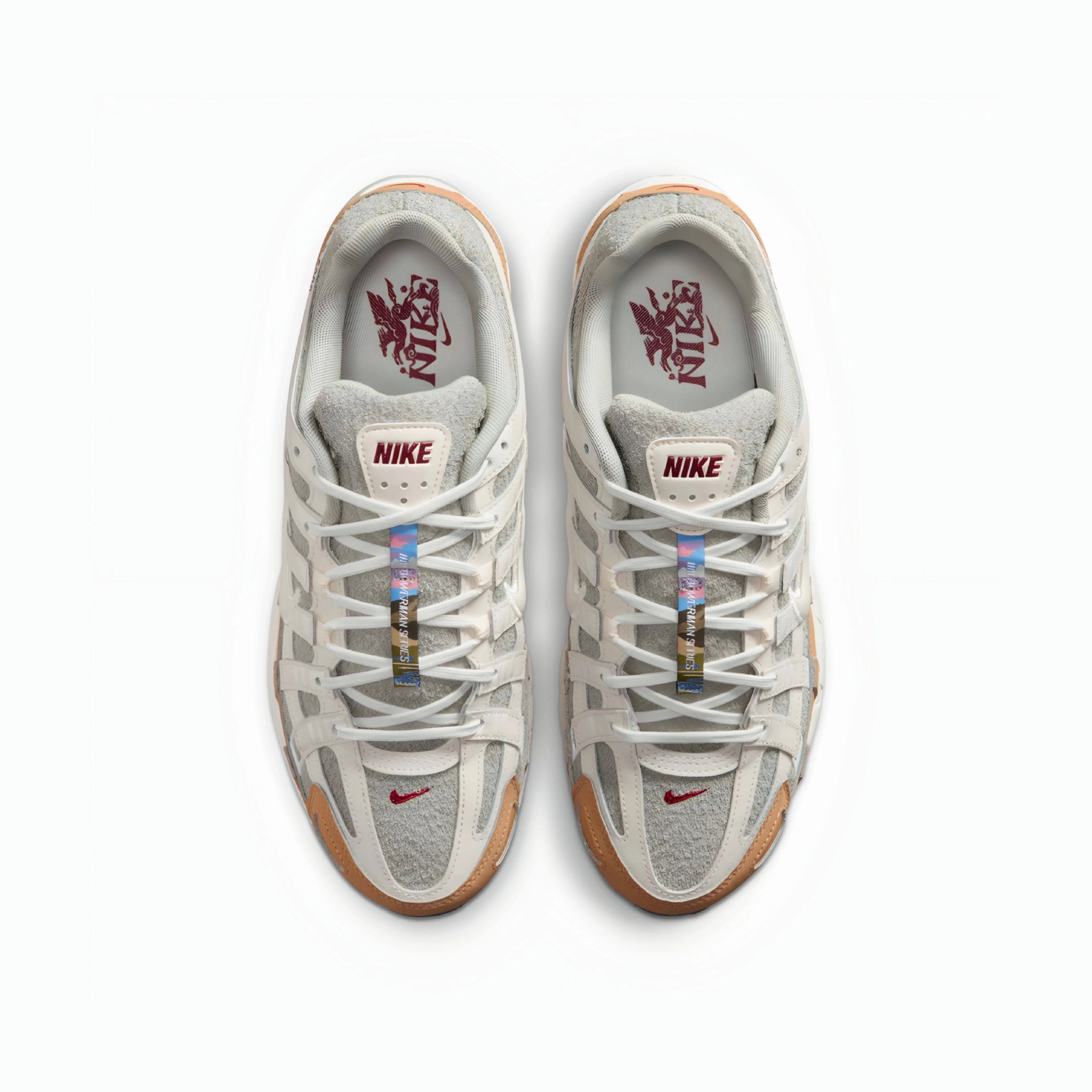 A pair of Nike P6000 sneakers shown from a top-down view on a clean white background. The shoes feature a light gray and white mesh and suede upper, white laces, a translucent gum outsole, and a red Nike Swoosh on the toe box.