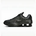 Triple Black nike shox r4 on a white background