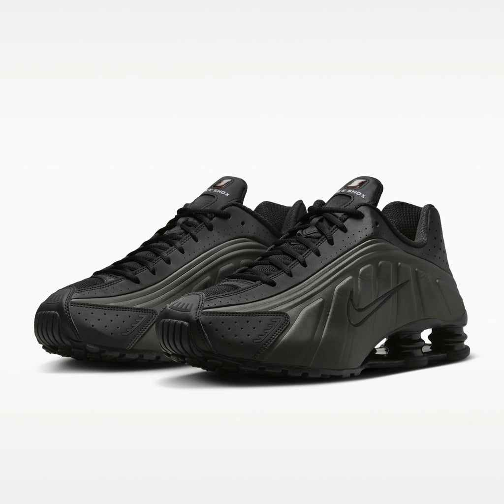 Pair of black sneakers on a white background
