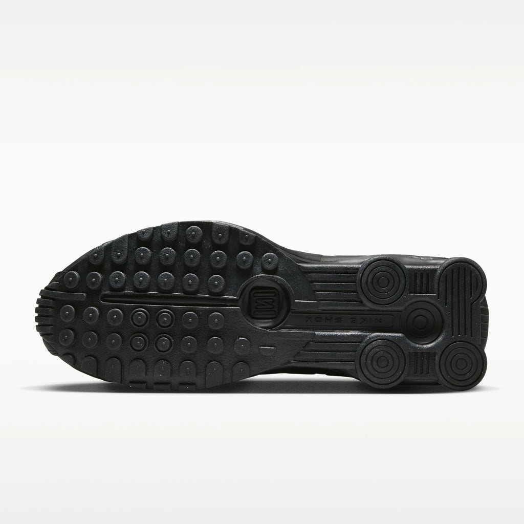 Black Nike shoe sole on a white background
