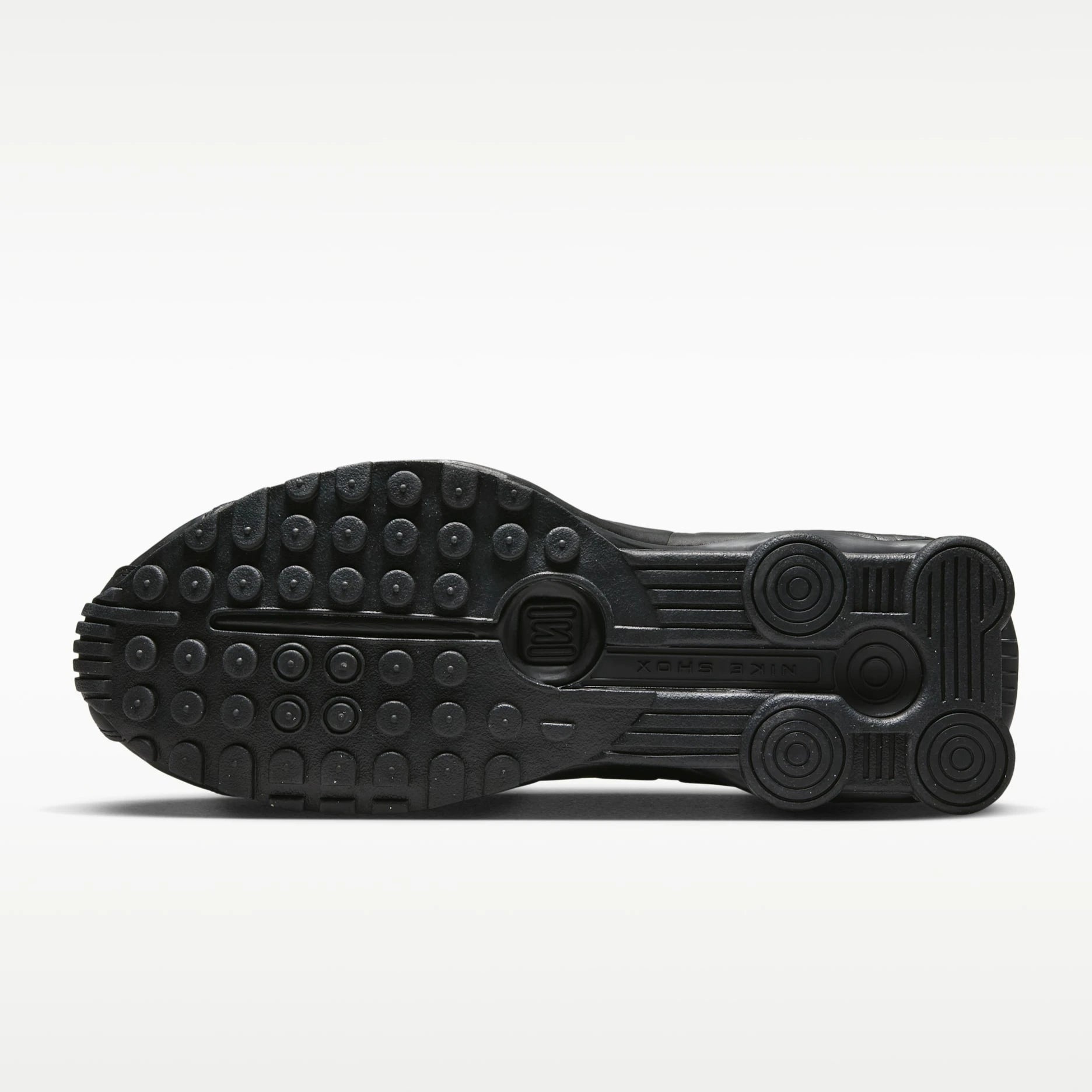 Black Nike shoe sole on a white background