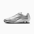 A metallic silver Nike Shox sneaker shown in a side profile view against a clean white background.