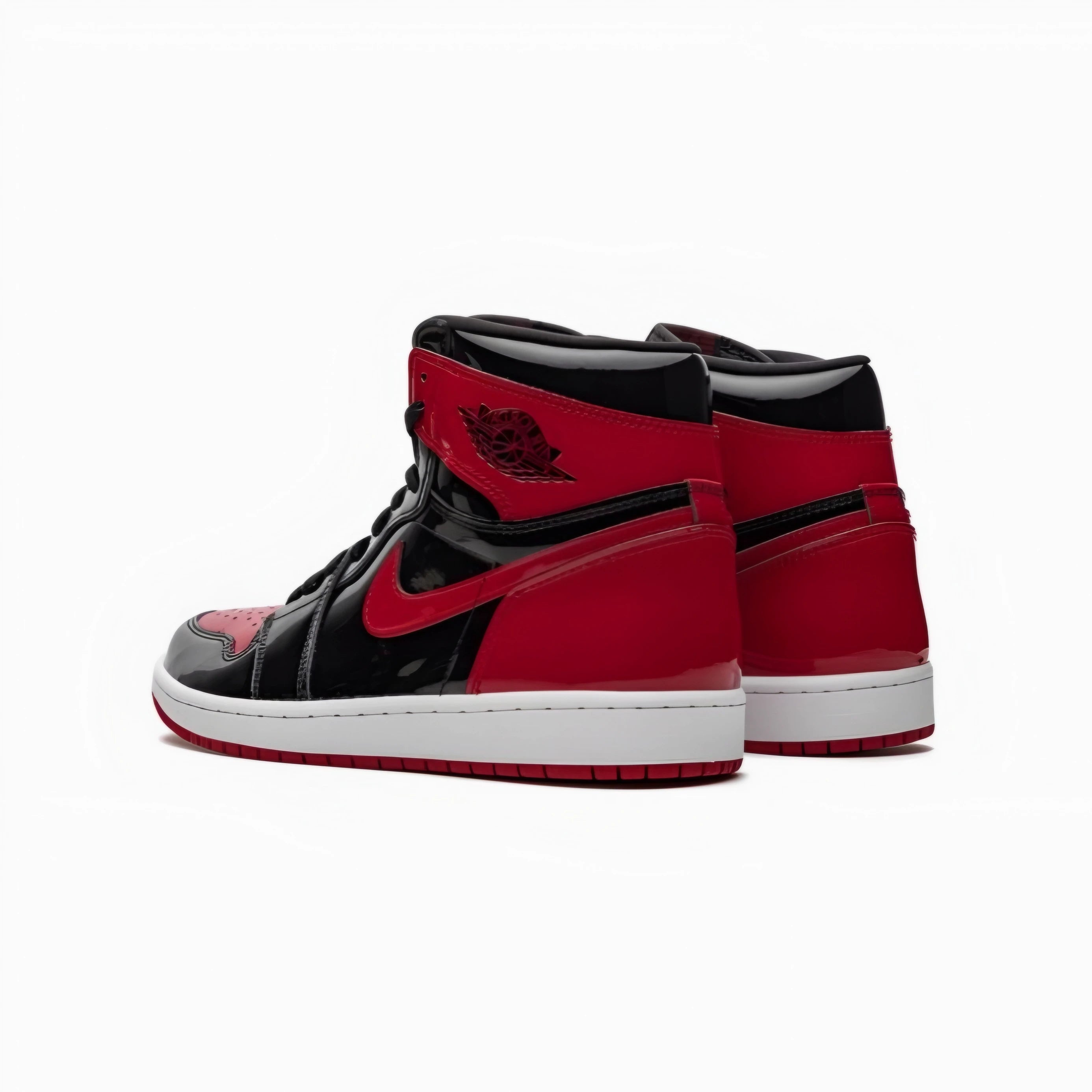 A pair of Jordan 1 high-top sneakers in red and black with a white midsole, shown from a side-rear angle on a clean white background.