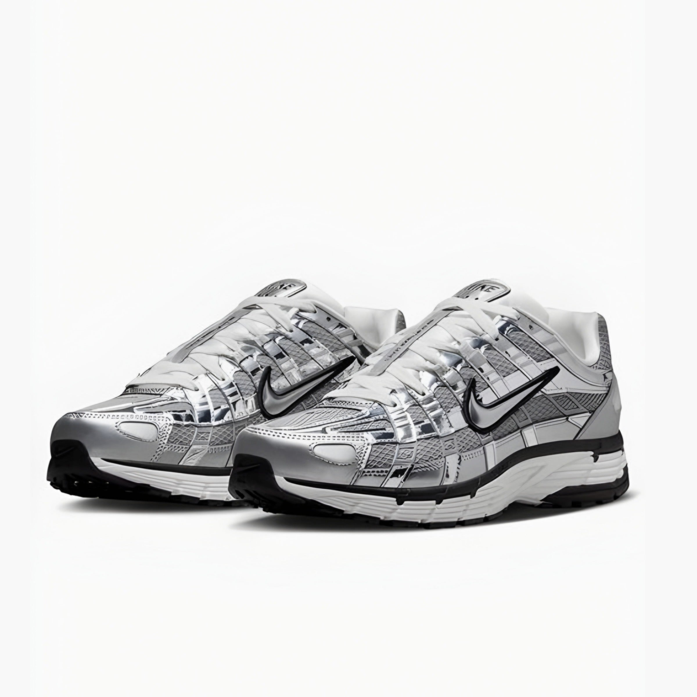 Pair of silver and black nike P6000 sneakers on a white background