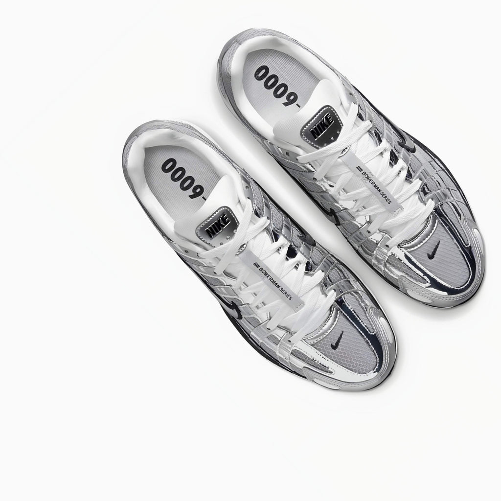 Nike P6000 Silver sneakers with '6000' branding on a white background
